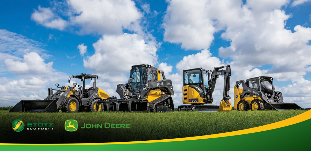 Image of John Deere construction equipment ins grassy field